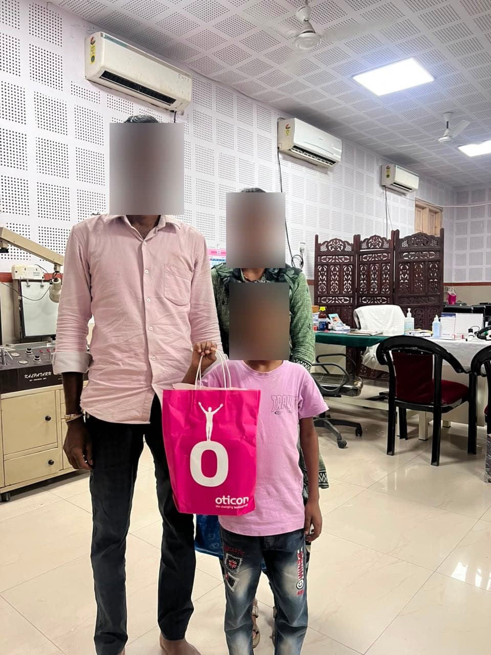 A family collecting hearing aids at the GMCH Nagpur audiology department
